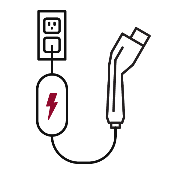 Illustration d’un chargeur branché sur une prise électrique standard. 