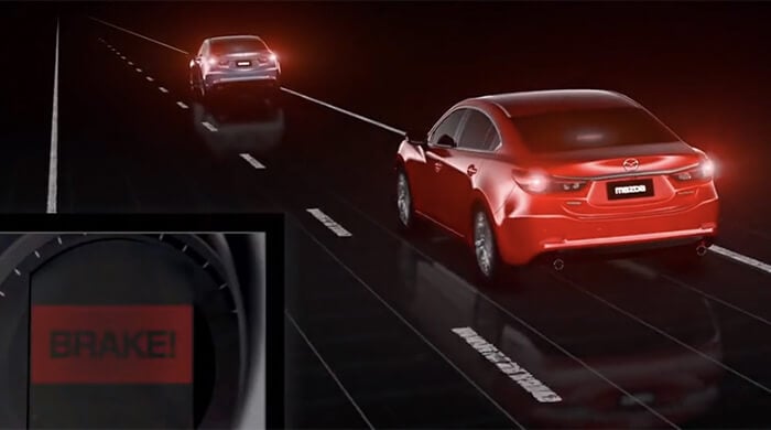 Red Mazda on road gets alerted about grey Mazda ahead