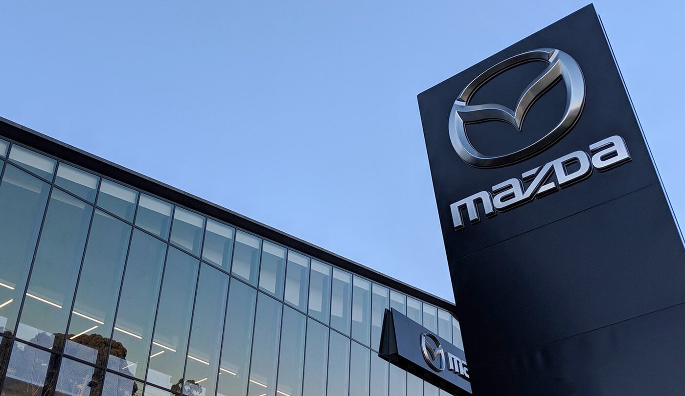 Mazda Retailer with large Mazda logo displayed on pillar