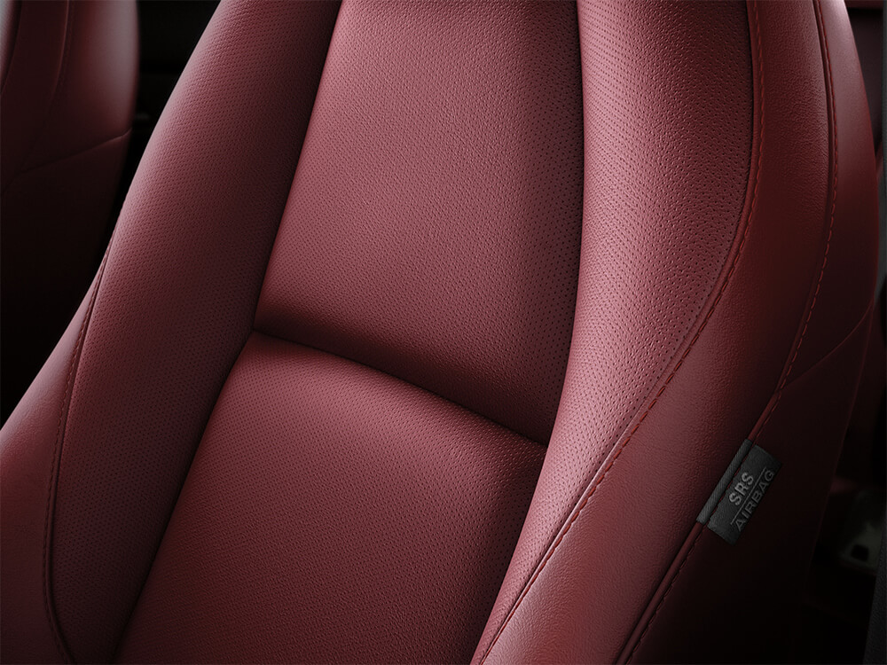 Close up of Garnet Red Leather driver’s seat.