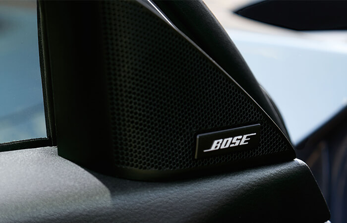 Close up of Bose speaker inside vehicle.