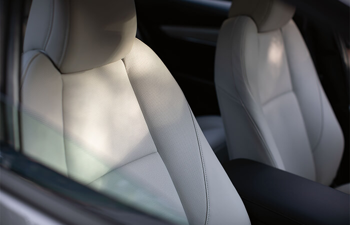 Comfortable front seating in the Mazda3 sedan.