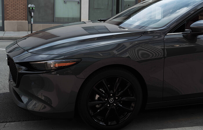 Front half of the Mazda3 sedan exterior.
