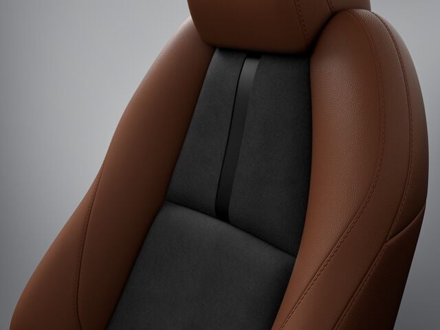 Single Mazda3 Sport Seat in Terracotta/Black Leatherette on grey backdrop.