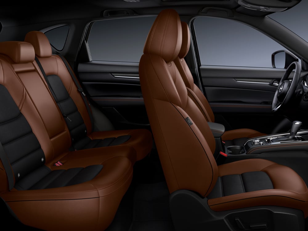 Unobstructed view of the entire CX-5 Terracotta/Black Leather interior from the passenger’s side.