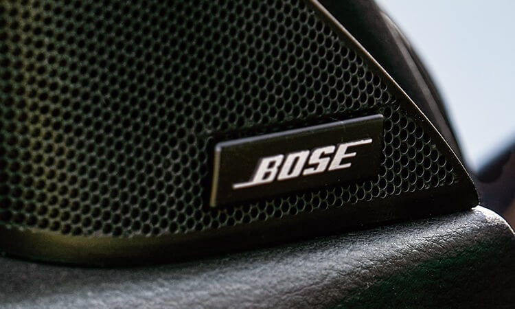 Close-up of driver’s side neodymium tweeter with Bose logo.