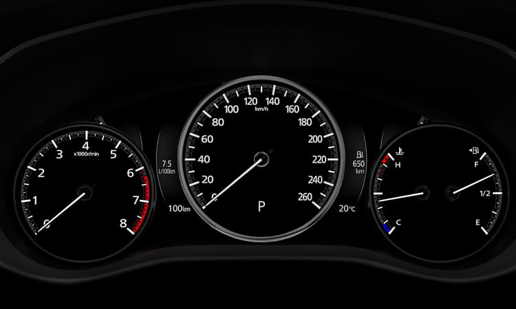 CX-50 digital dash displays speedometer dial, as well as RPM dial, and temperature/fuel gauges. 