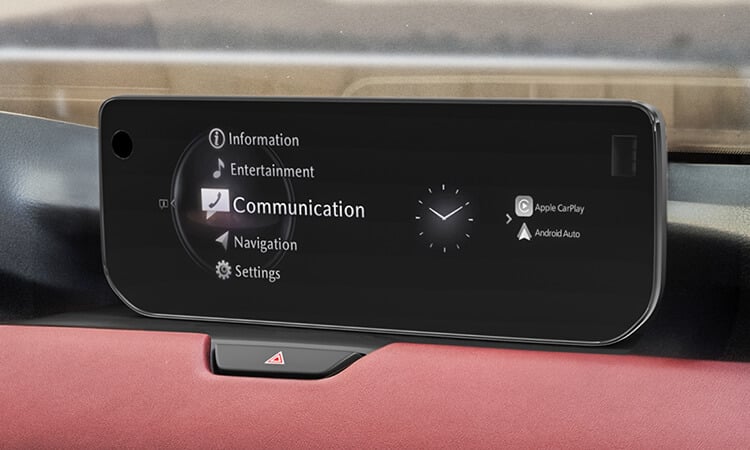 Centre infotainment display highlights “Communication”, the time of day and smartphone connectivity options.