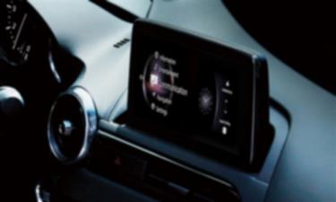 Interior view of the MX-5 ST dashboard with the touchscreen interface displaying a variety of apps.