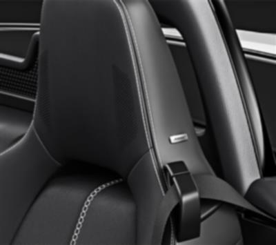 Image of MX-5 RF car seat headrest with integrated audio system. 